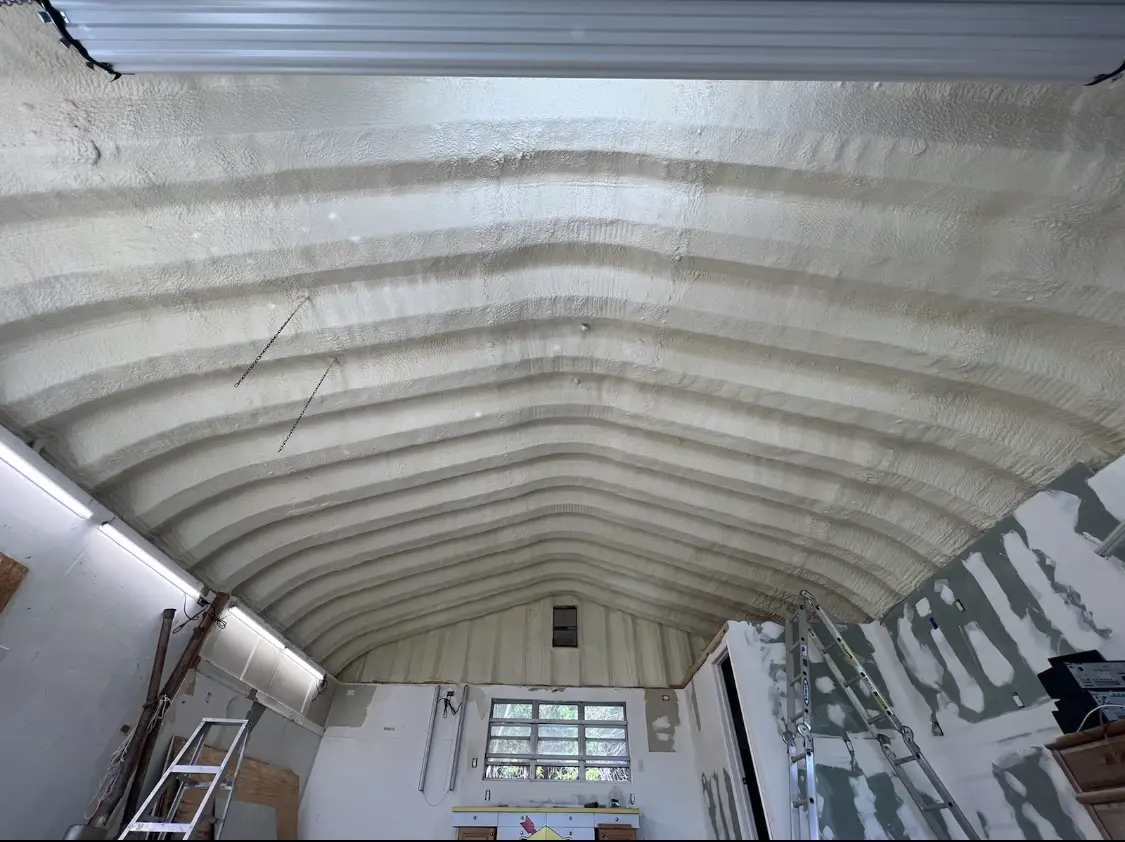 Spray polyurethane foam applied to the underside of a metal roof deck in Scotia